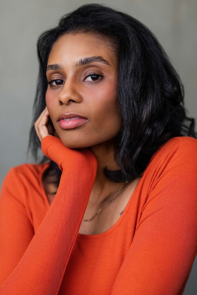 a woman in an orange shirt